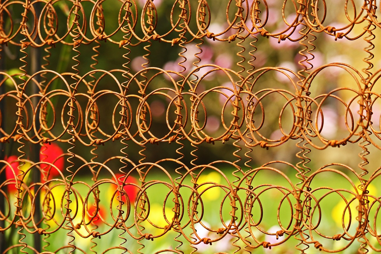 Photo of outdoor rusted spring art installation.