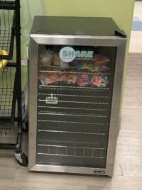 Small fridge with snacks in it